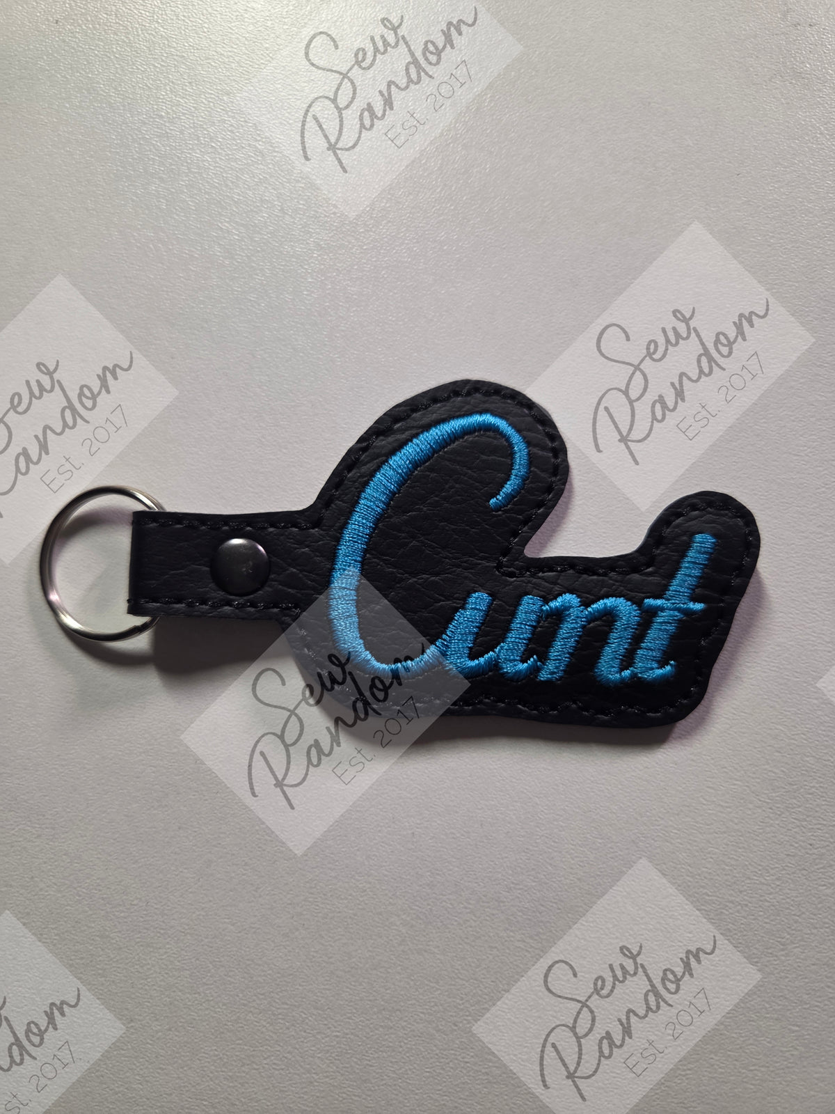C WORD KEYRING - BLACK/BLUE