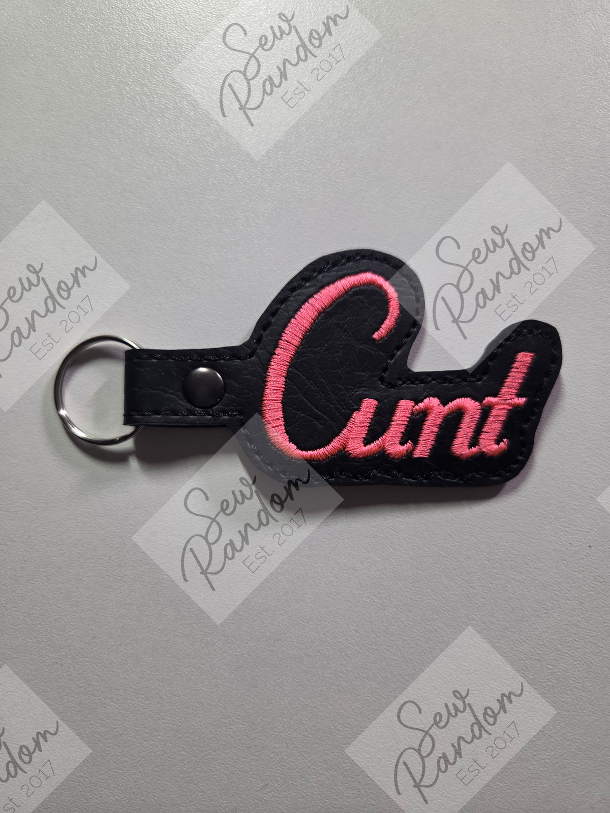 C WORD KEYRING - BLACK/NEON CORAL PINK