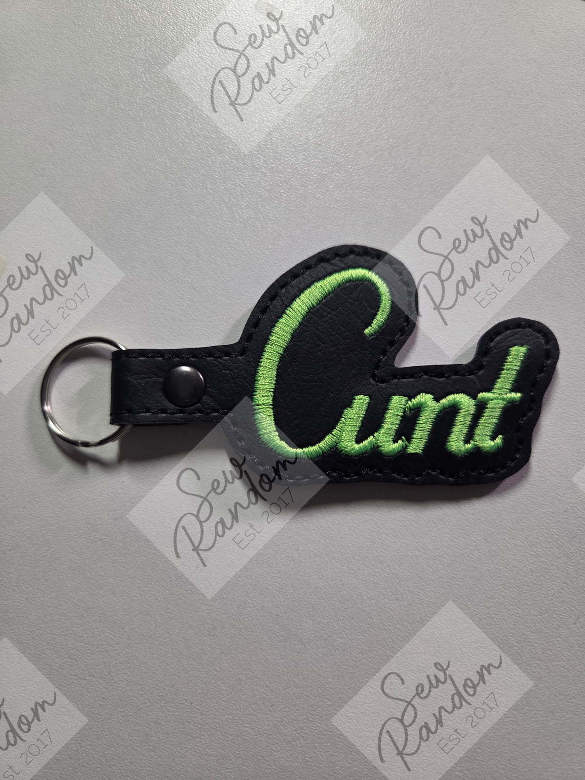 C WORD KEYRING - BLACK/NEON GREEN