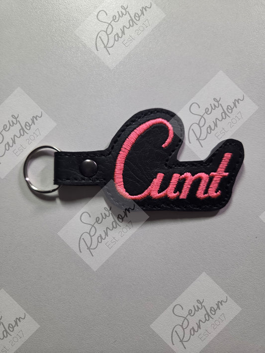 C WORD KEYRING - BLACK/NEON CORAL PINK